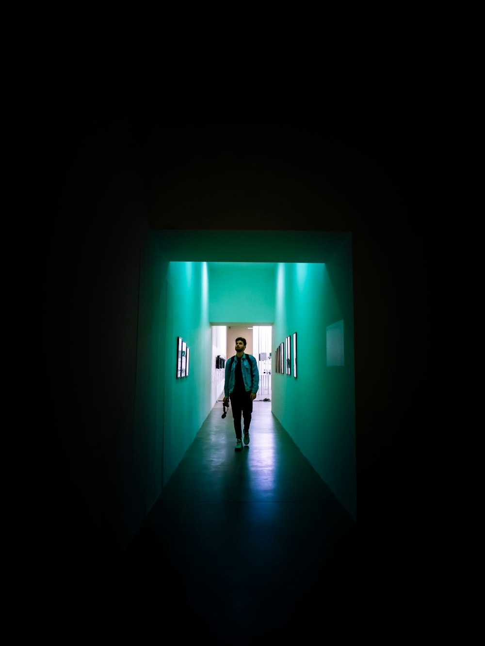 2 person walking on hallway