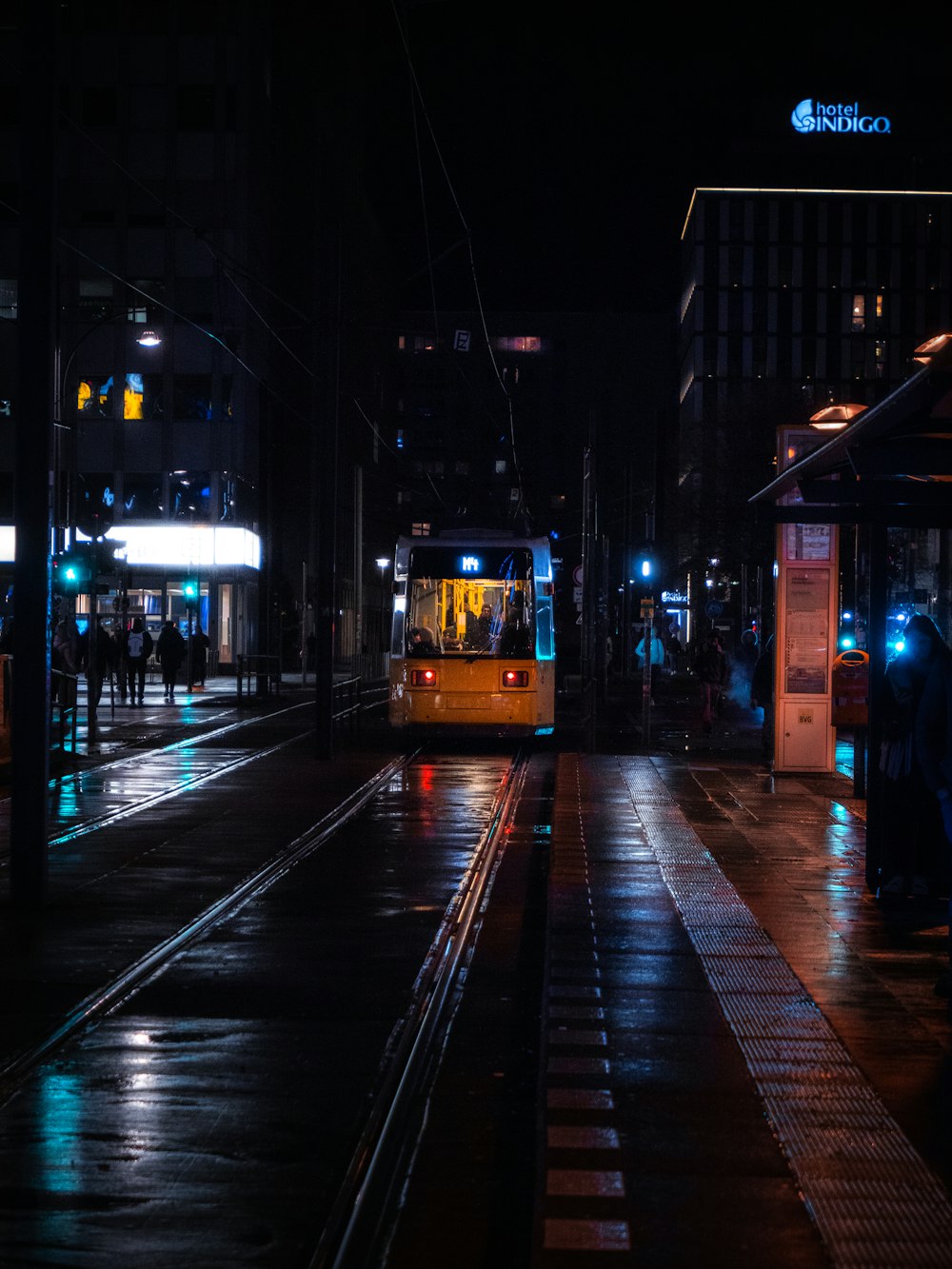 yellow tram on the street during night time