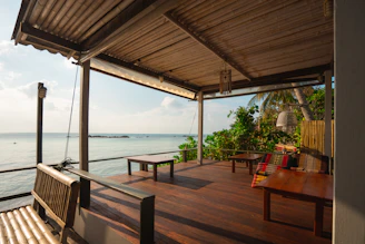 A stunning ocean-view deck built with natural materials blending into the Hawaiian landscape.