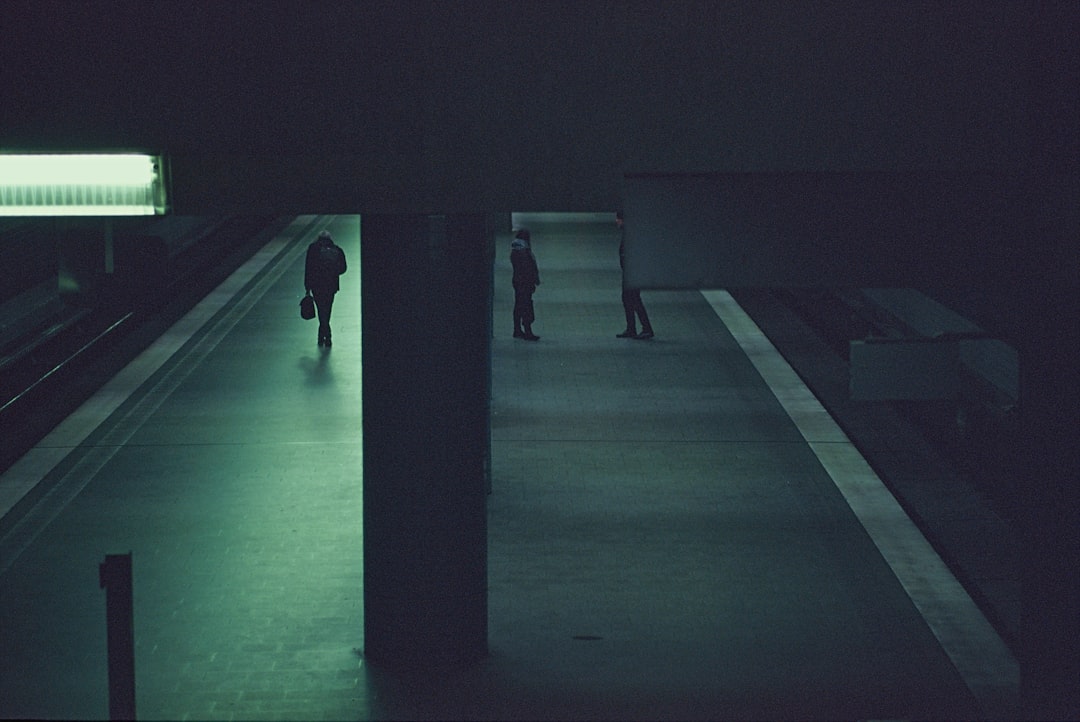 person walking on gray concrete pavement