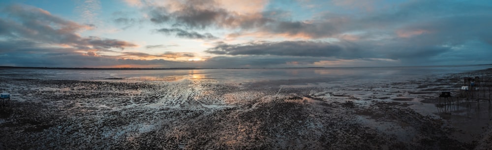 body of water under cloudy sky during daytime