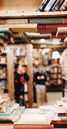 books on brown wooden shelf