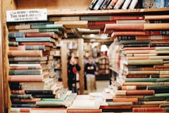 books on brown wooden shelf