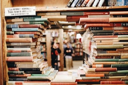 books on brown wooden shelf