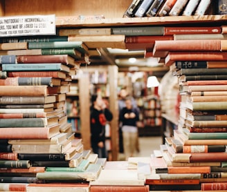 books on brown wooden shelf