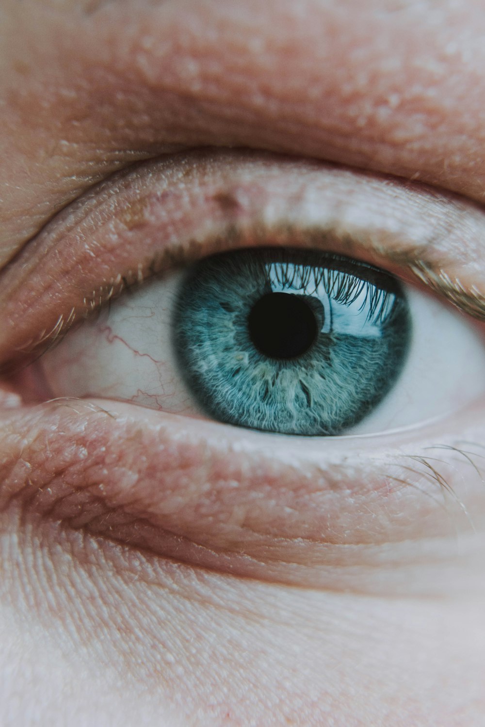 persons eye in close up photography