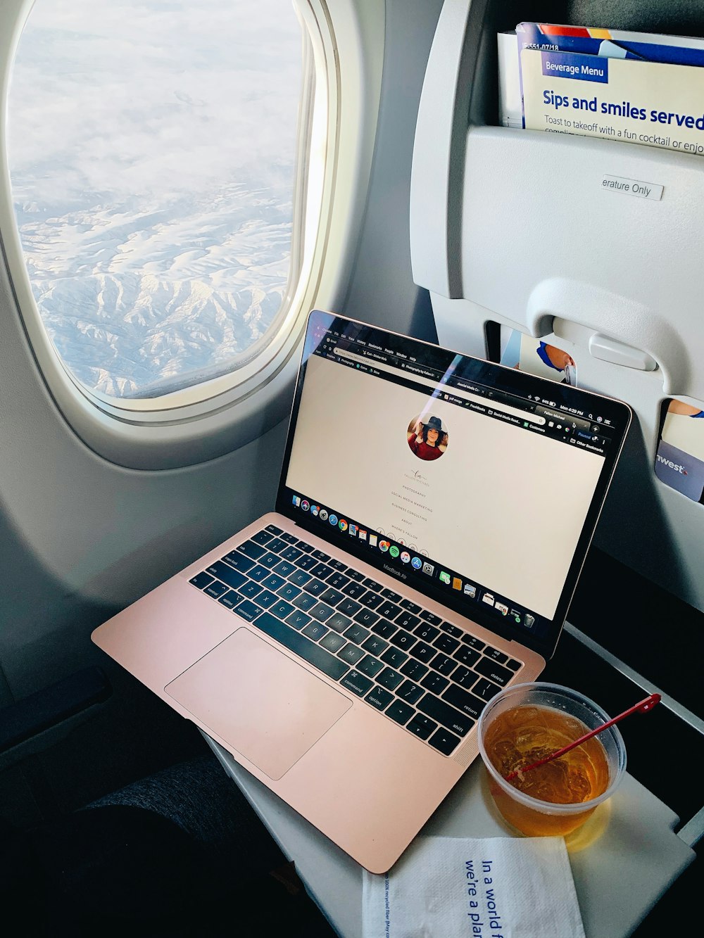 a laptop computer sitting on top of a table