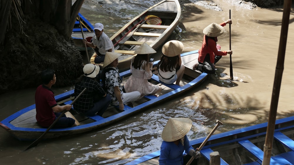 people riding on boat during daytime