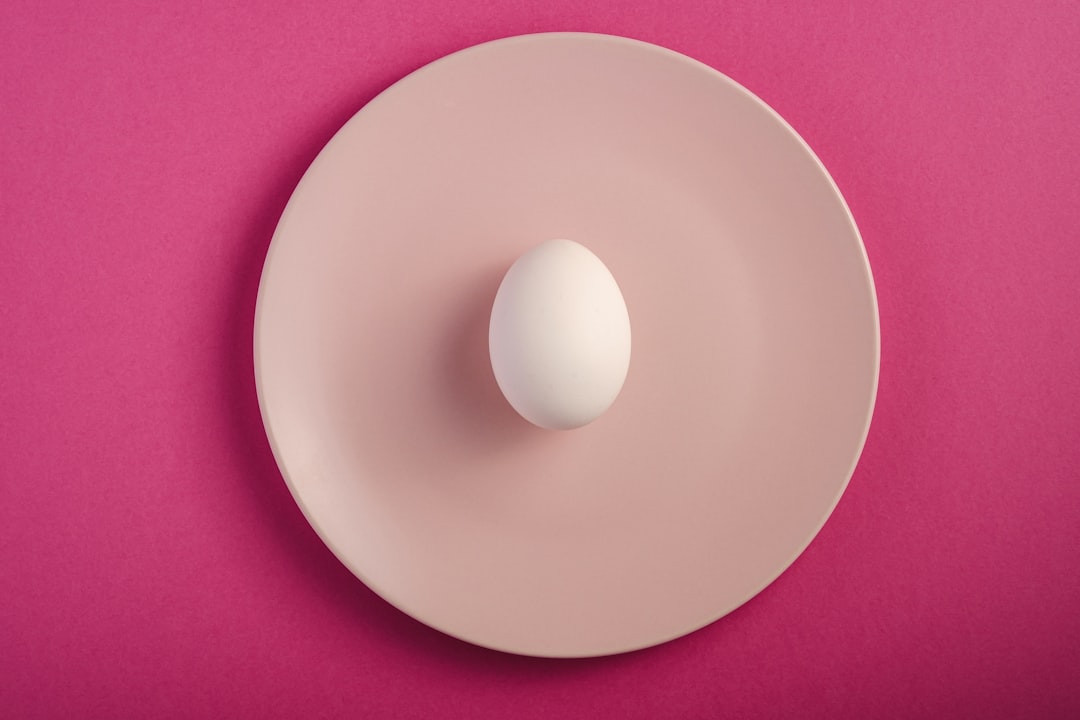  white round plate on pink textile plate