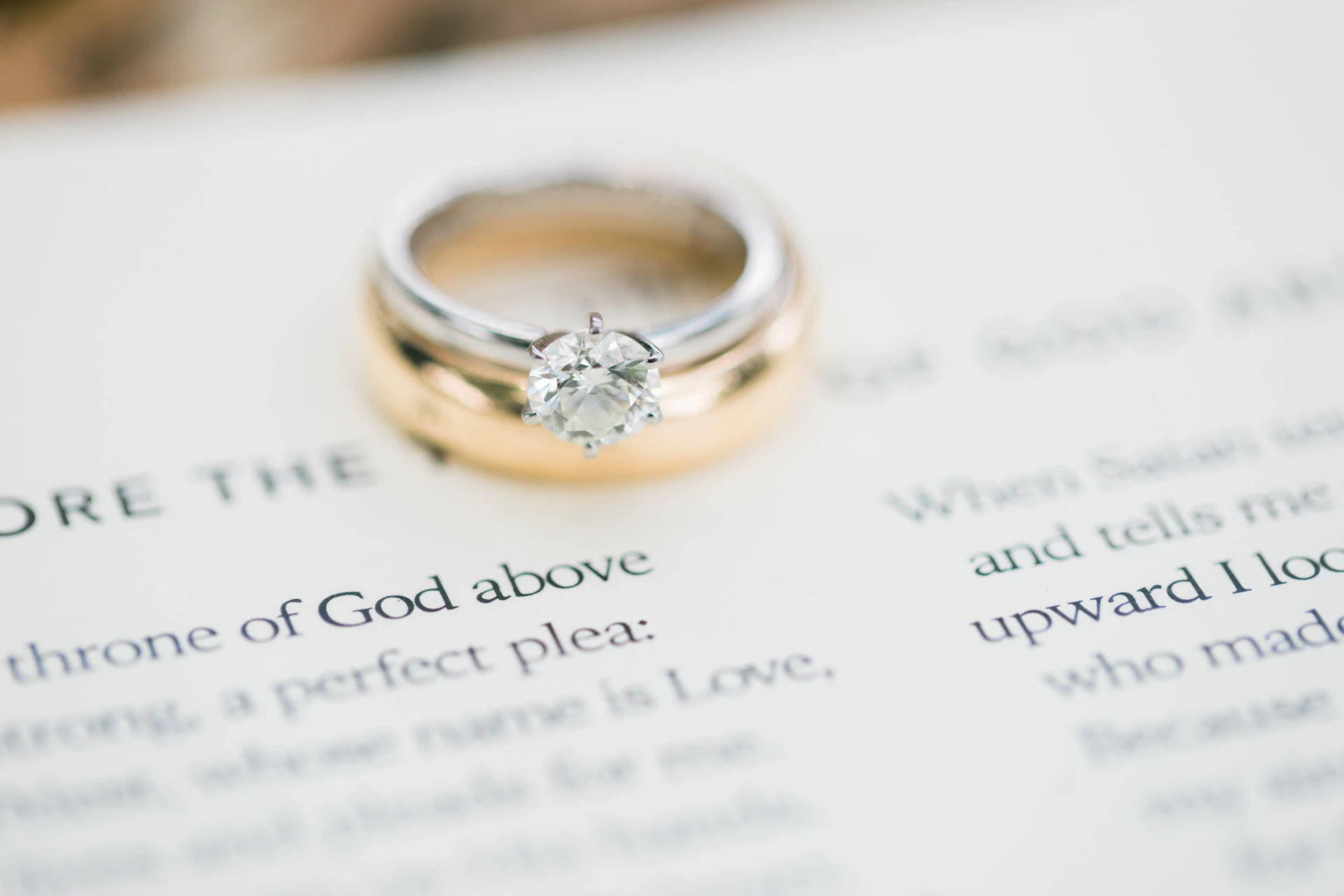 gold ring on white printer paper