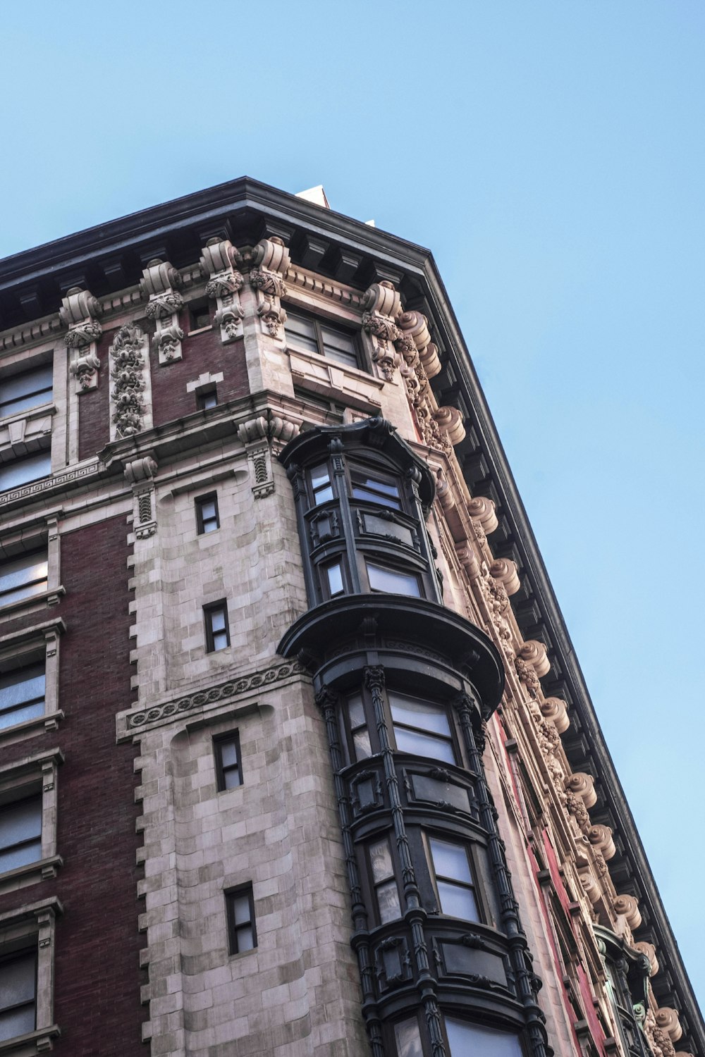 brown concrete building under blue sky during daytime