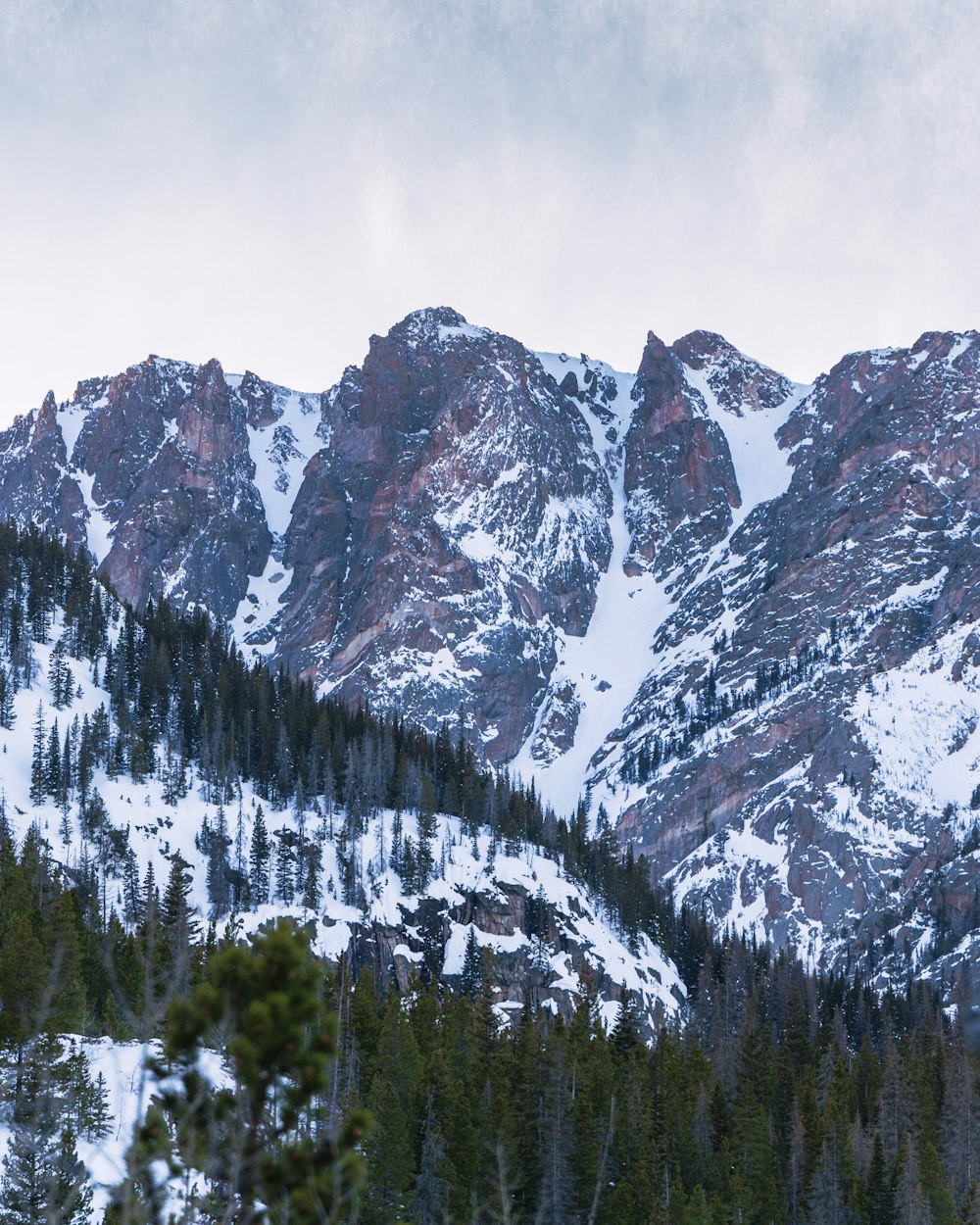 snow covered mountain during daytime