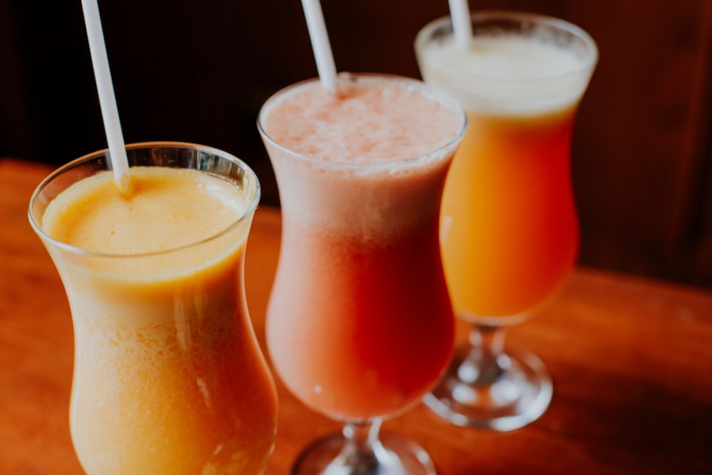 orange juice in clear drinking glass