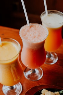 orange juice in clear drinking glass