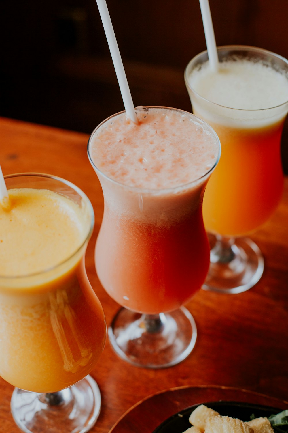 orange juice in clear drinking glass