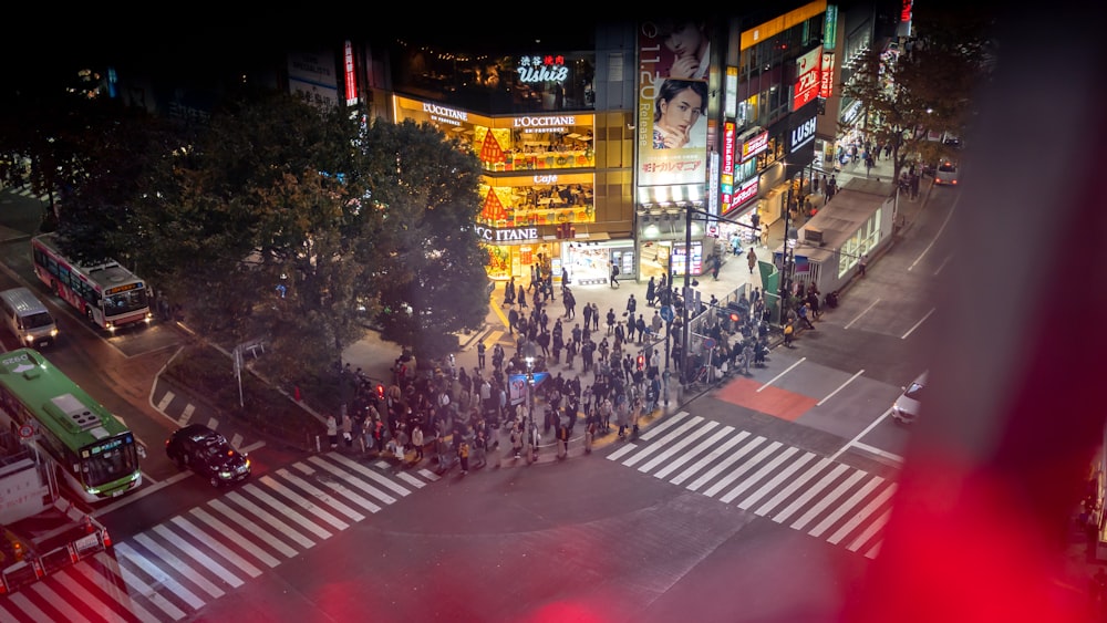 people walking on street during nighttime