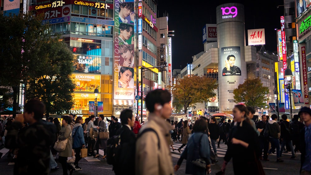 people walking on street during night time