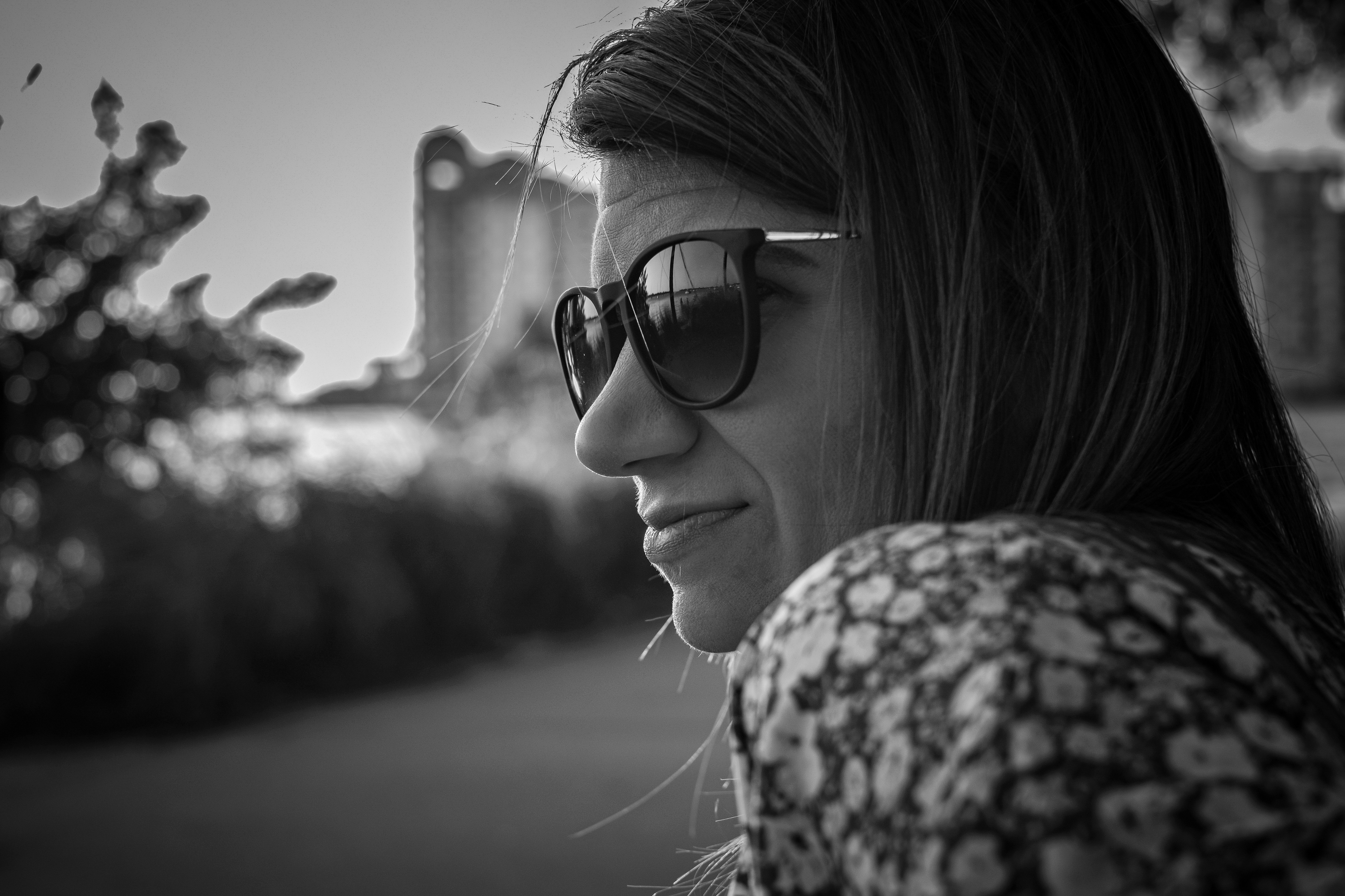 grayscale photo of woman wearing sunglasses