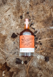 brown and white labeled bottle