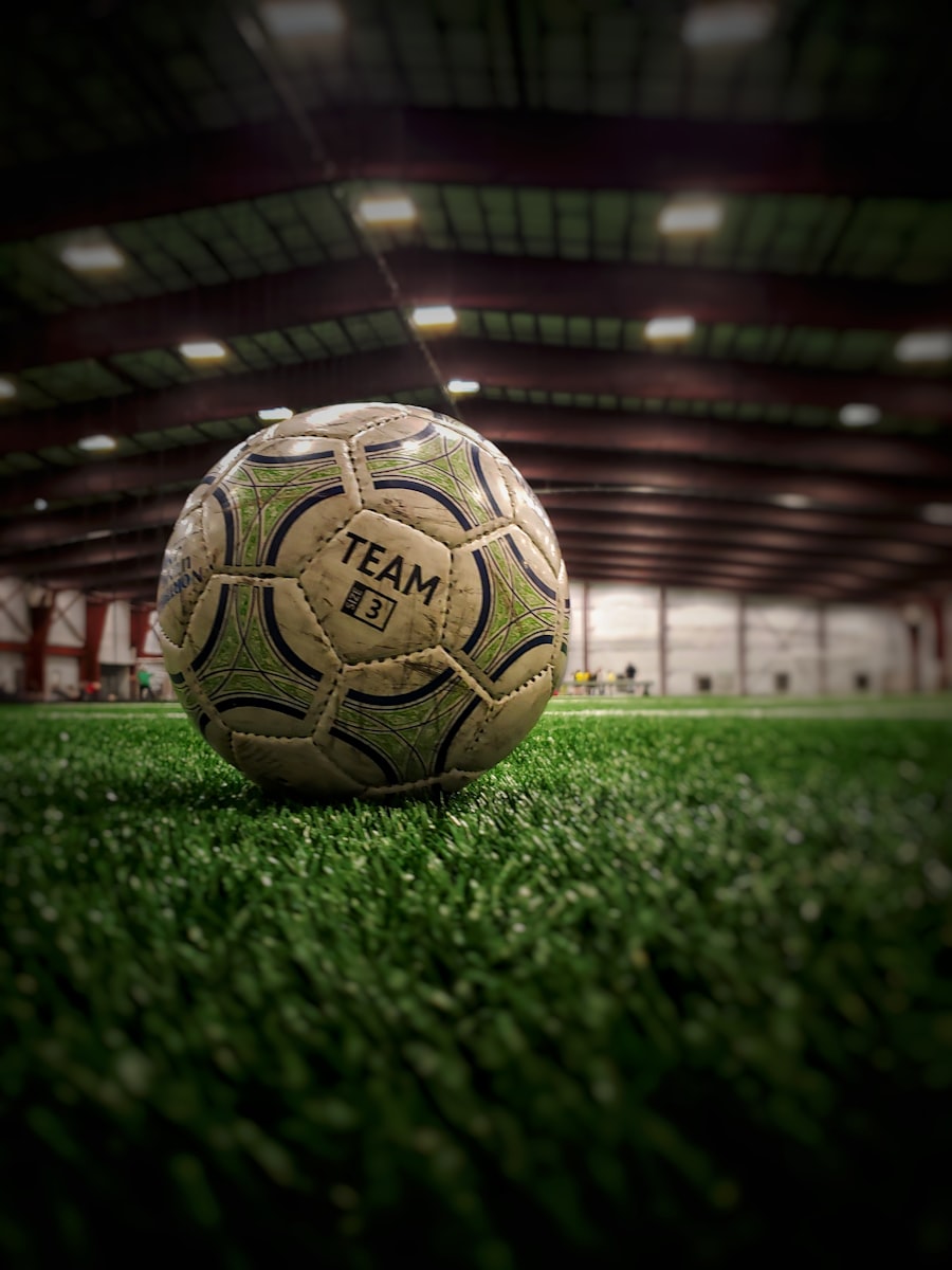 Soccer ball resting on the pitch