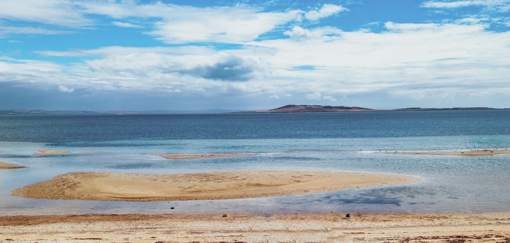 blue sea under blue sky during daytime