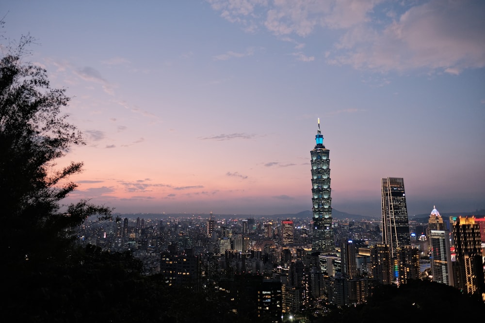 city skyline under blue sky during sunset