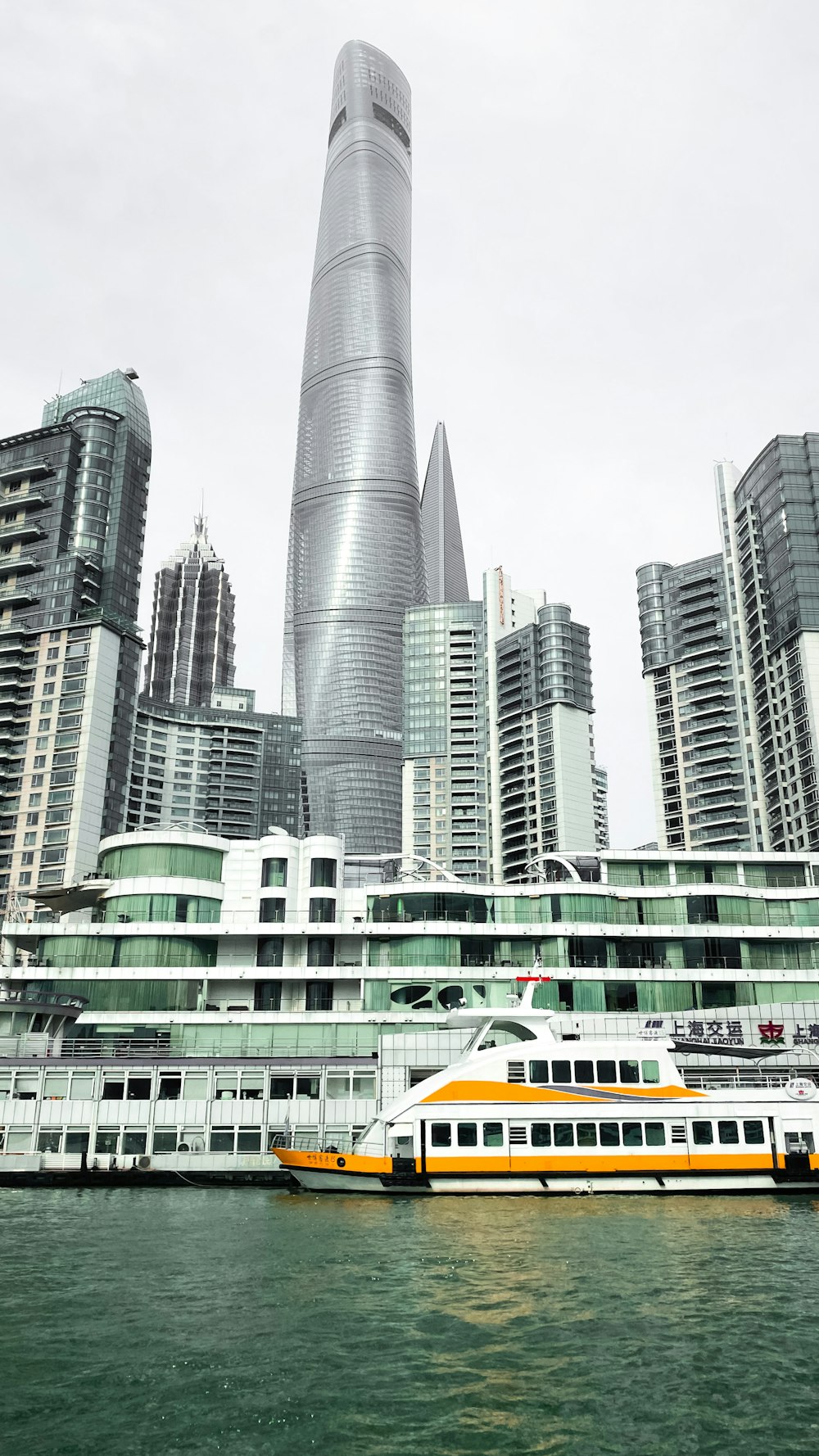 white and yellow bus on road near high rise buildings during daytime