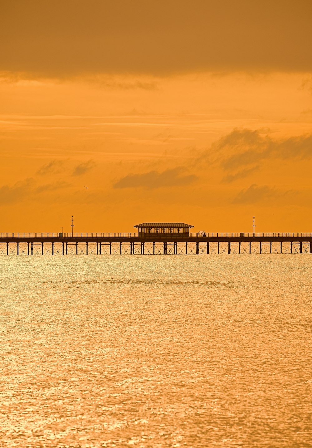 white and brown wooden dock on blue sea under blue sky during daytime