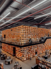 people in a building with brown cardboard boxes