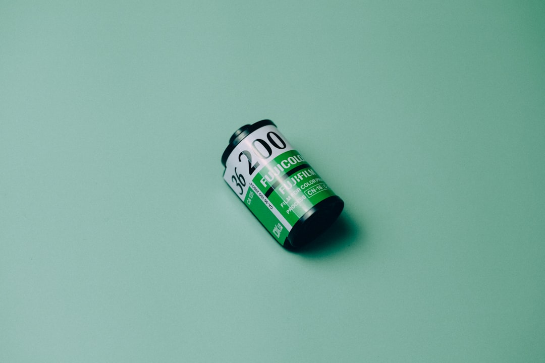 green and black can on white table