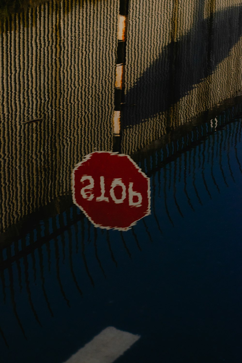 stop sign on brown wall