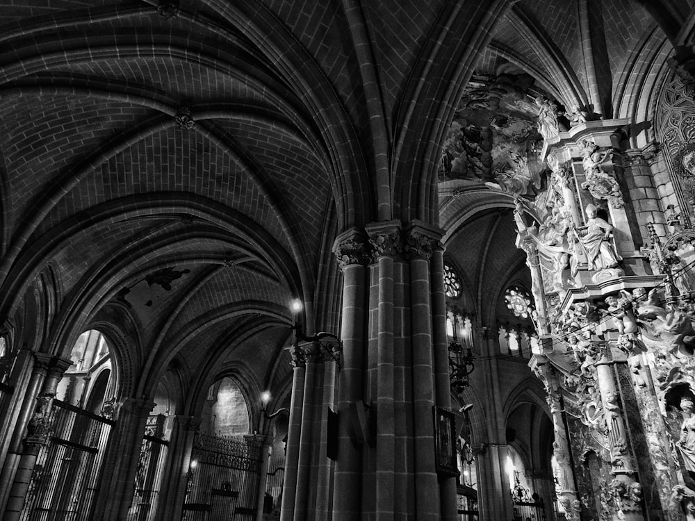 gray scale photo of cathedral interior