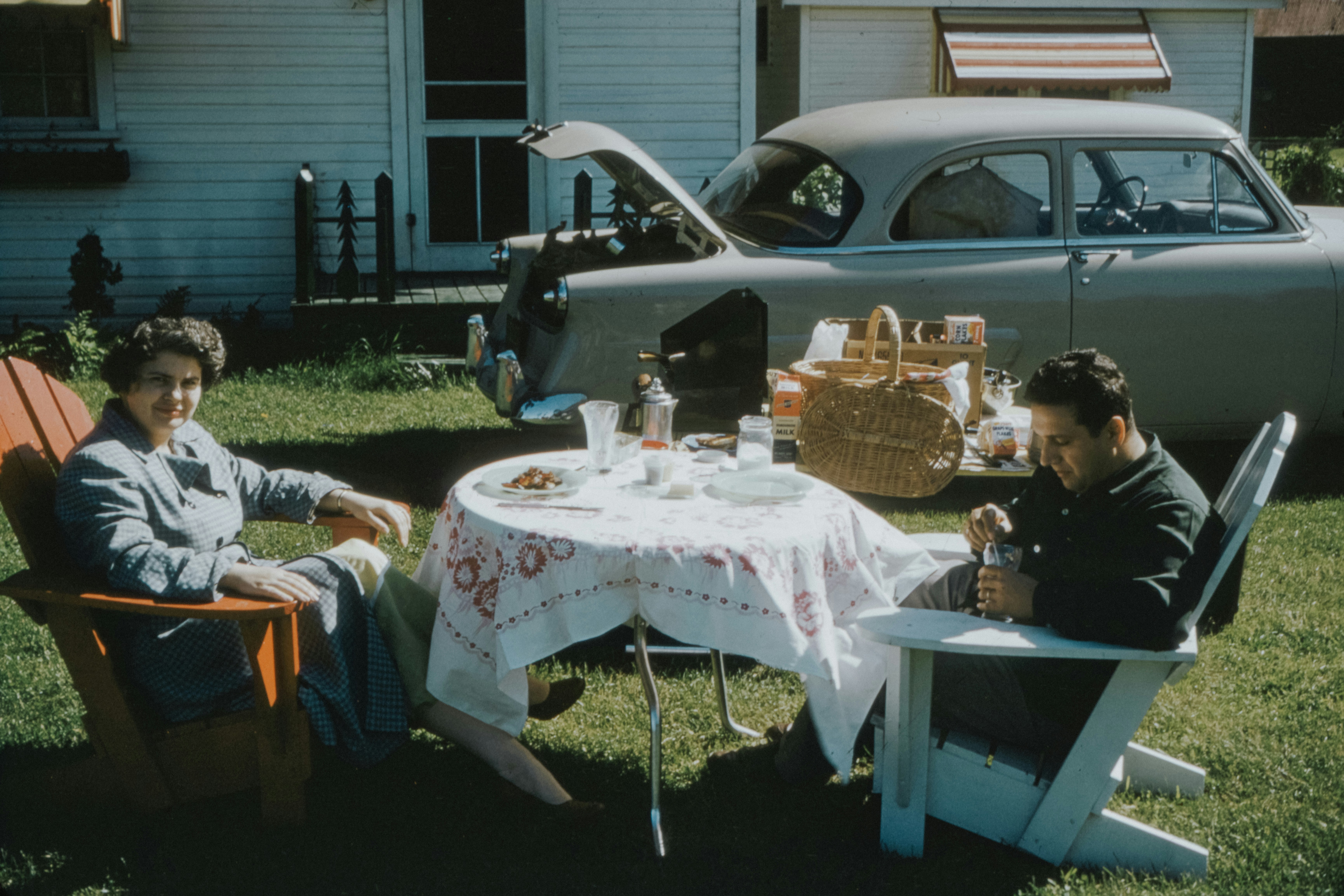 A happy family gathering around the dinner table in a cozy Canadian home