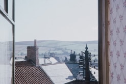 Window view from the double room showing city rooftops.