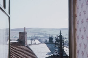Window view from the double room showing city rooftops.
