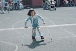 girl in blue and white striped long sleeve shirt and blue denim jeans holding walking stick