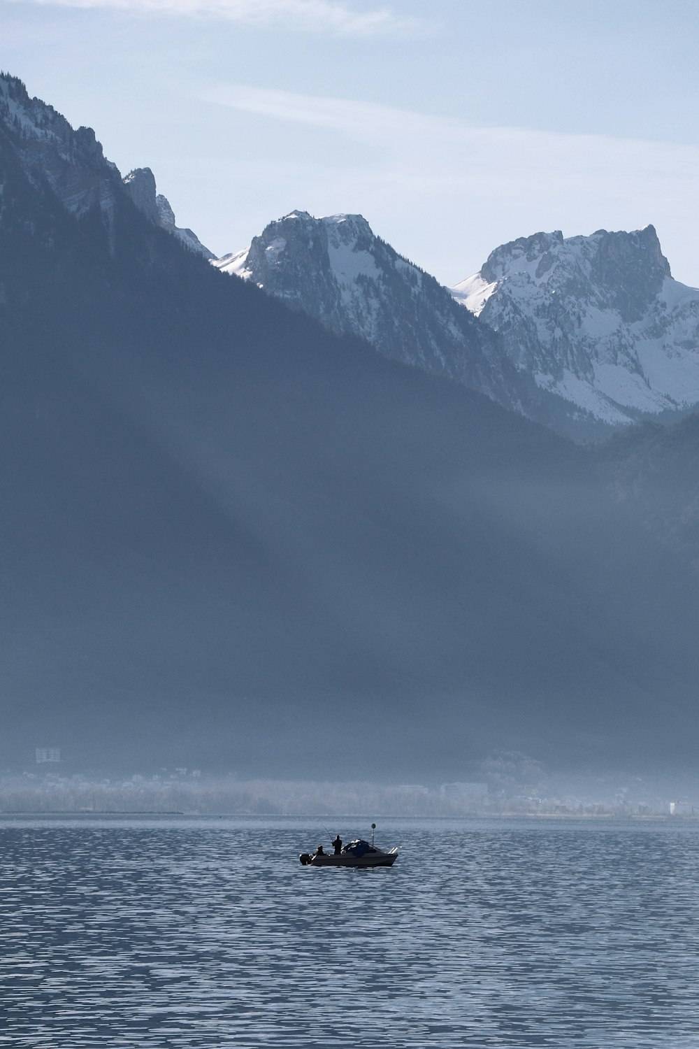 black and white mountains near body of water during daytime