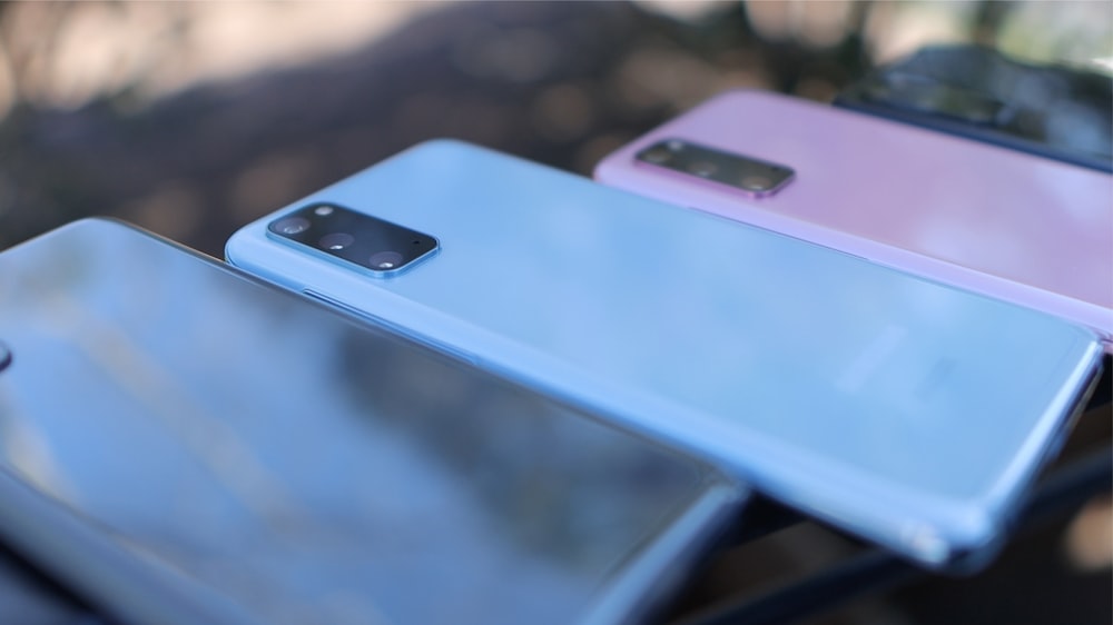 silver iphone 6 on blue table