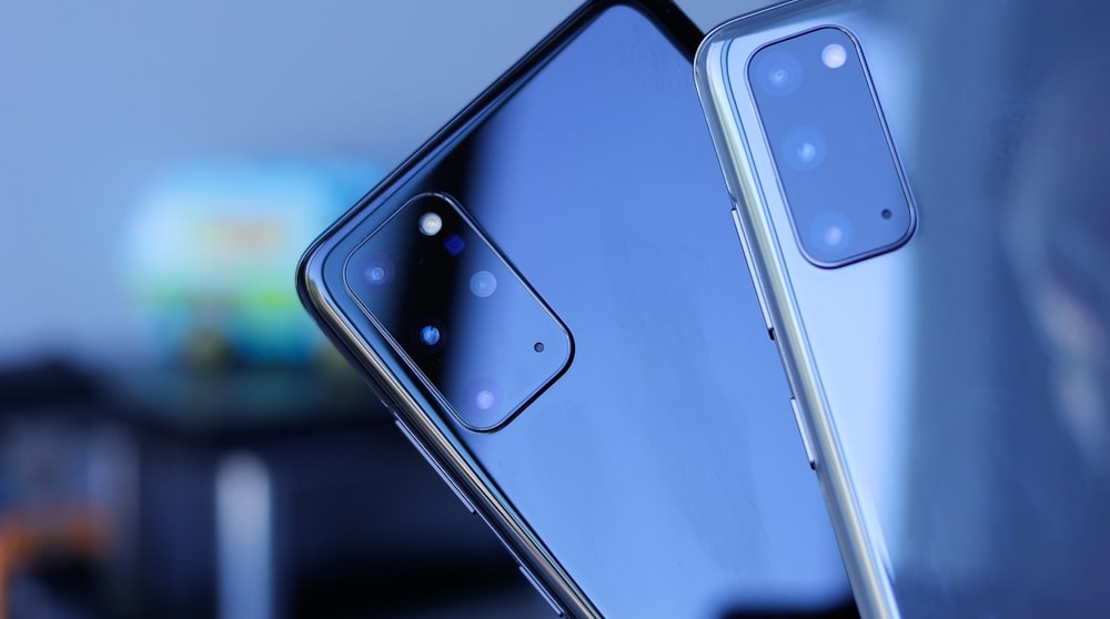 blue iphone 5 c on black surface