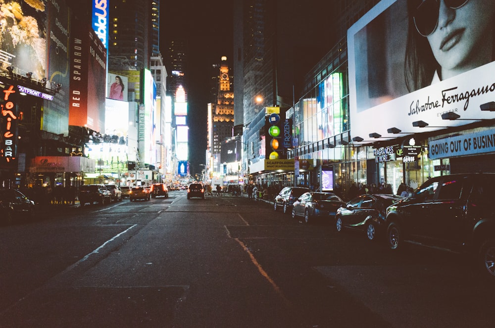 cars parked on sidewalk during night time