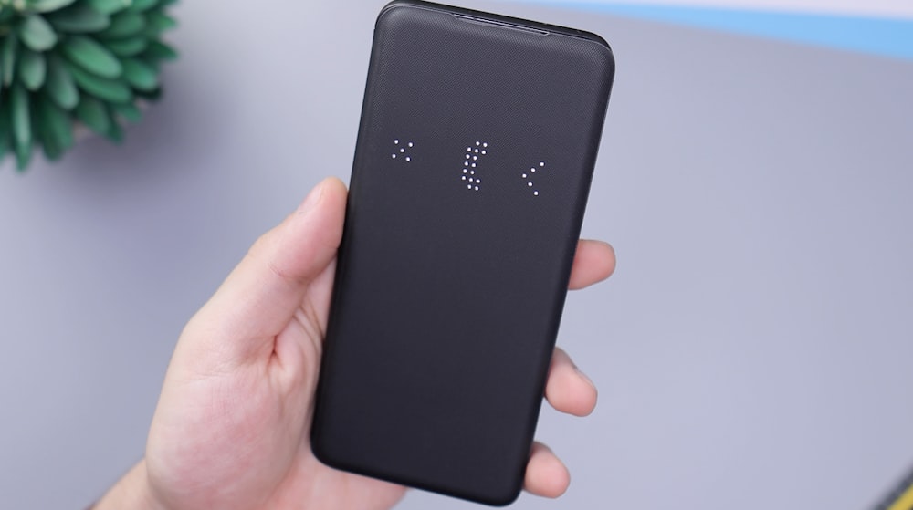 black huawei android smartphone on persons hand