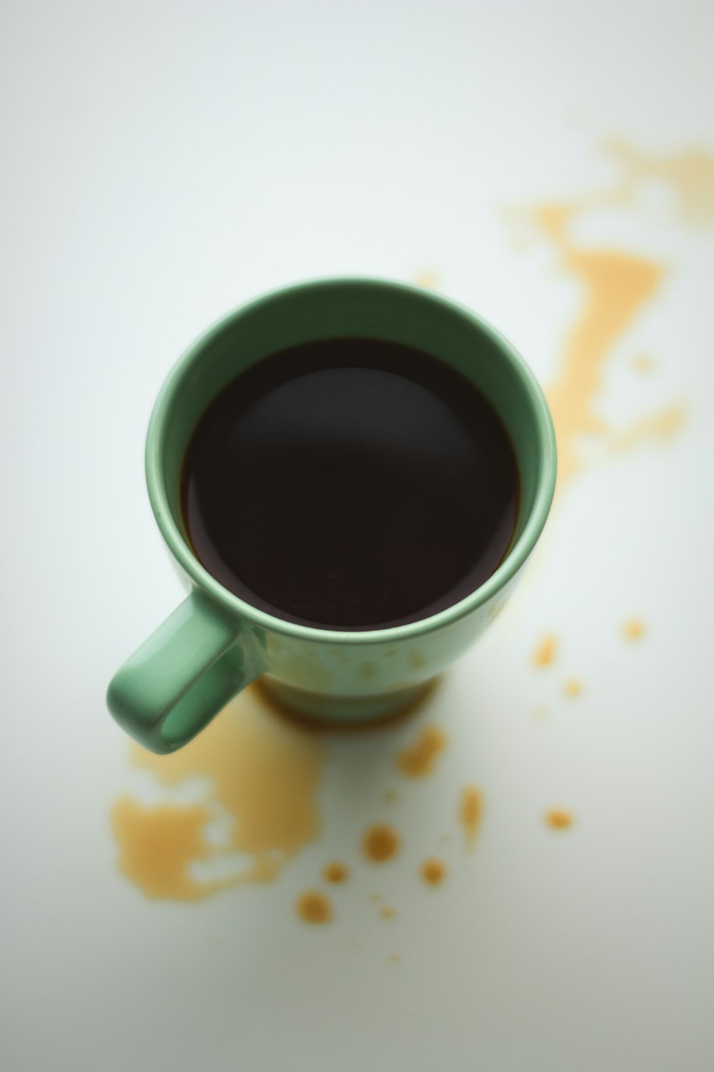 white ceramic mug with black liquid