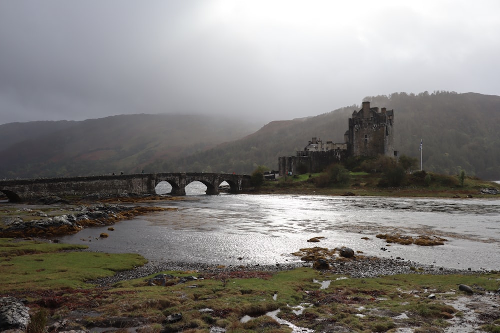 gray concrete bridge over river during daytime