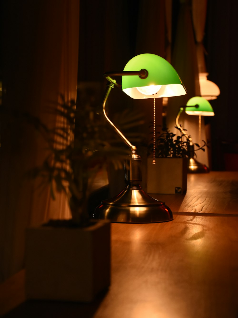 green and silver table lamp