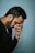 man in black shirt holding telephone