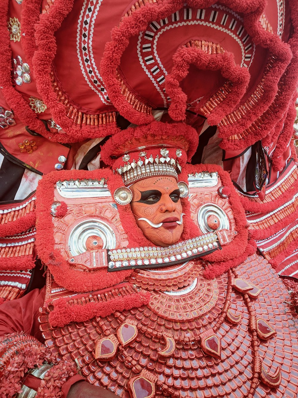 red and white skull with wings