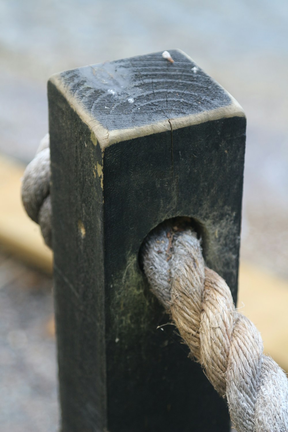 white rope on black wooden post