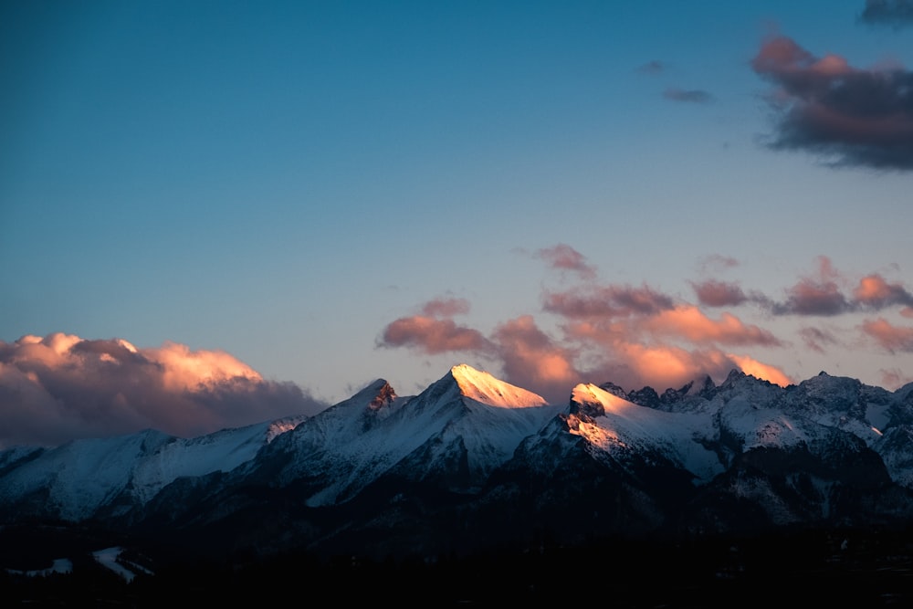 snow covered mountain under blue sky during daytime