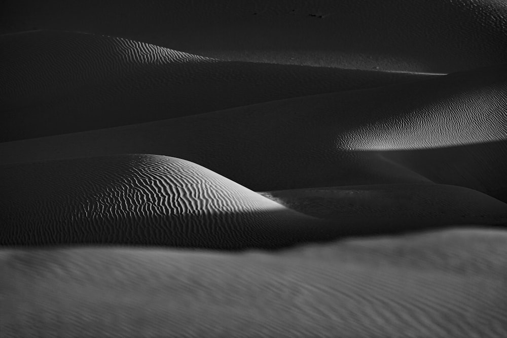 grayscale photo of sand dunes