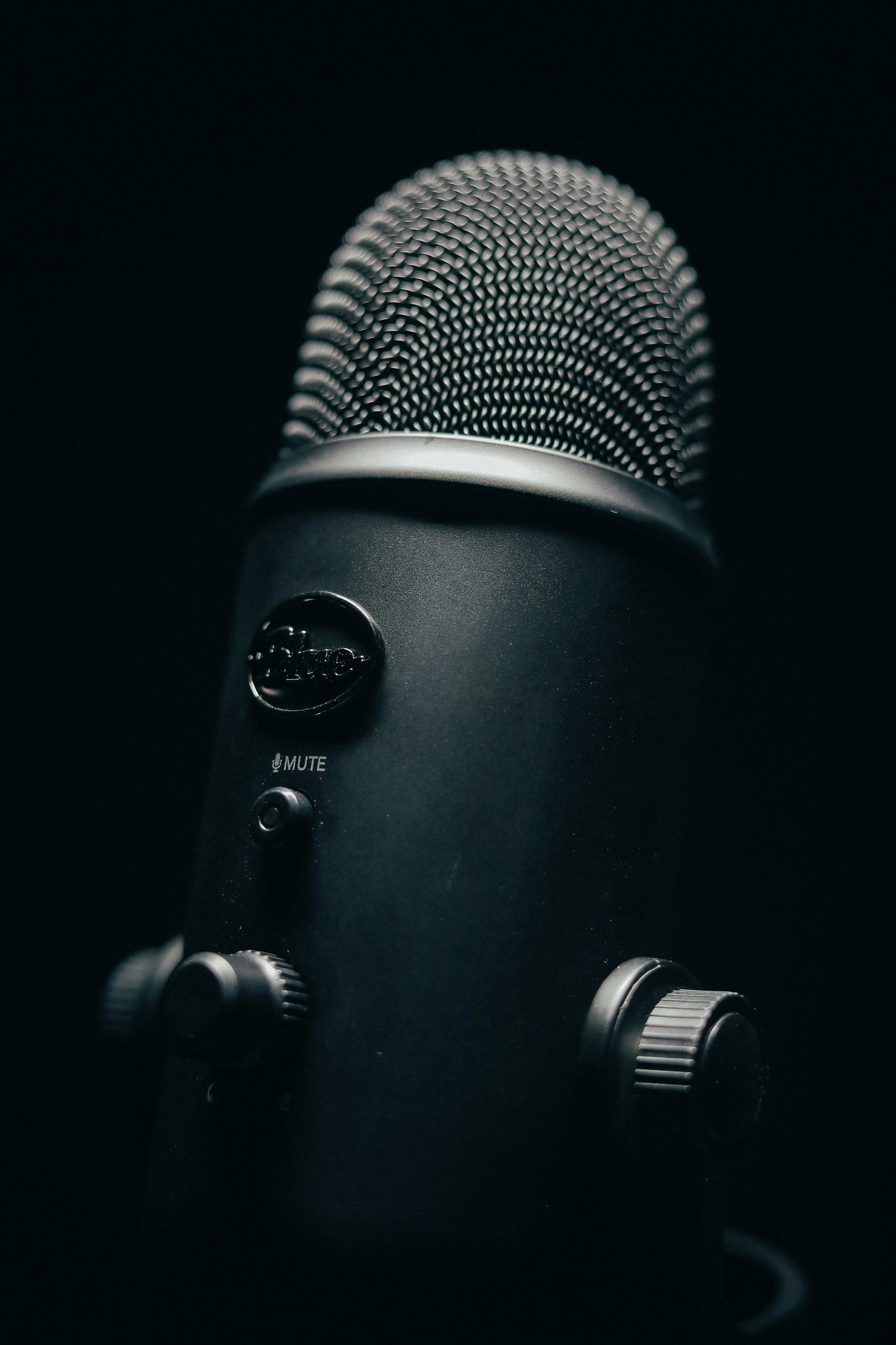 black and silver microphone with black background